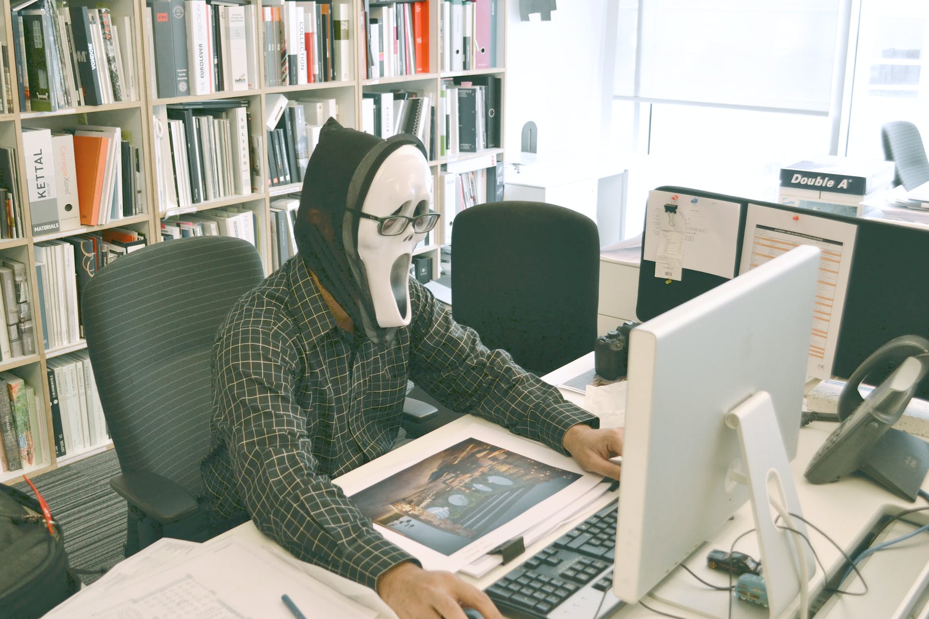 Hacker wearing scream mask and practicing hacking - Difference between hacking and ethical hacking